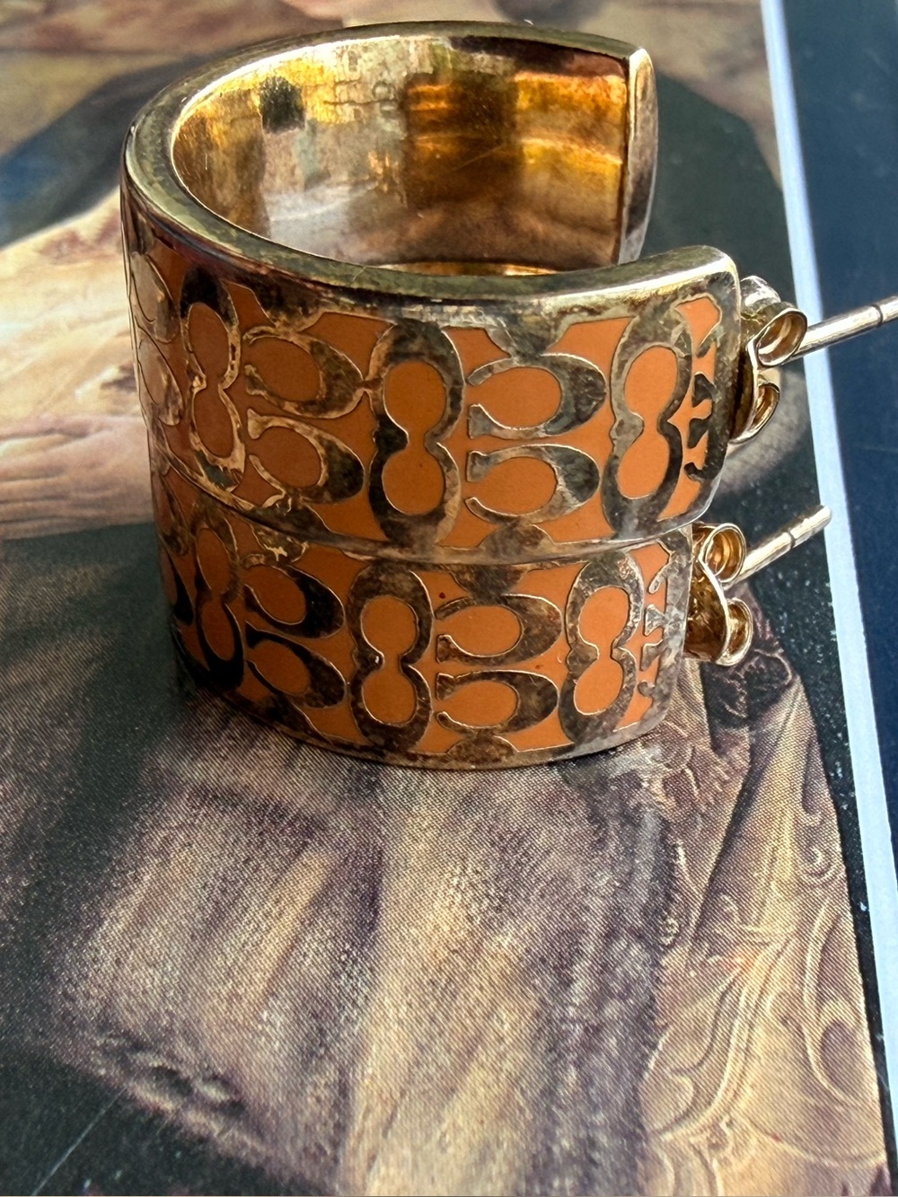 Coach Orange and Gold Cutout Hoop Earrings